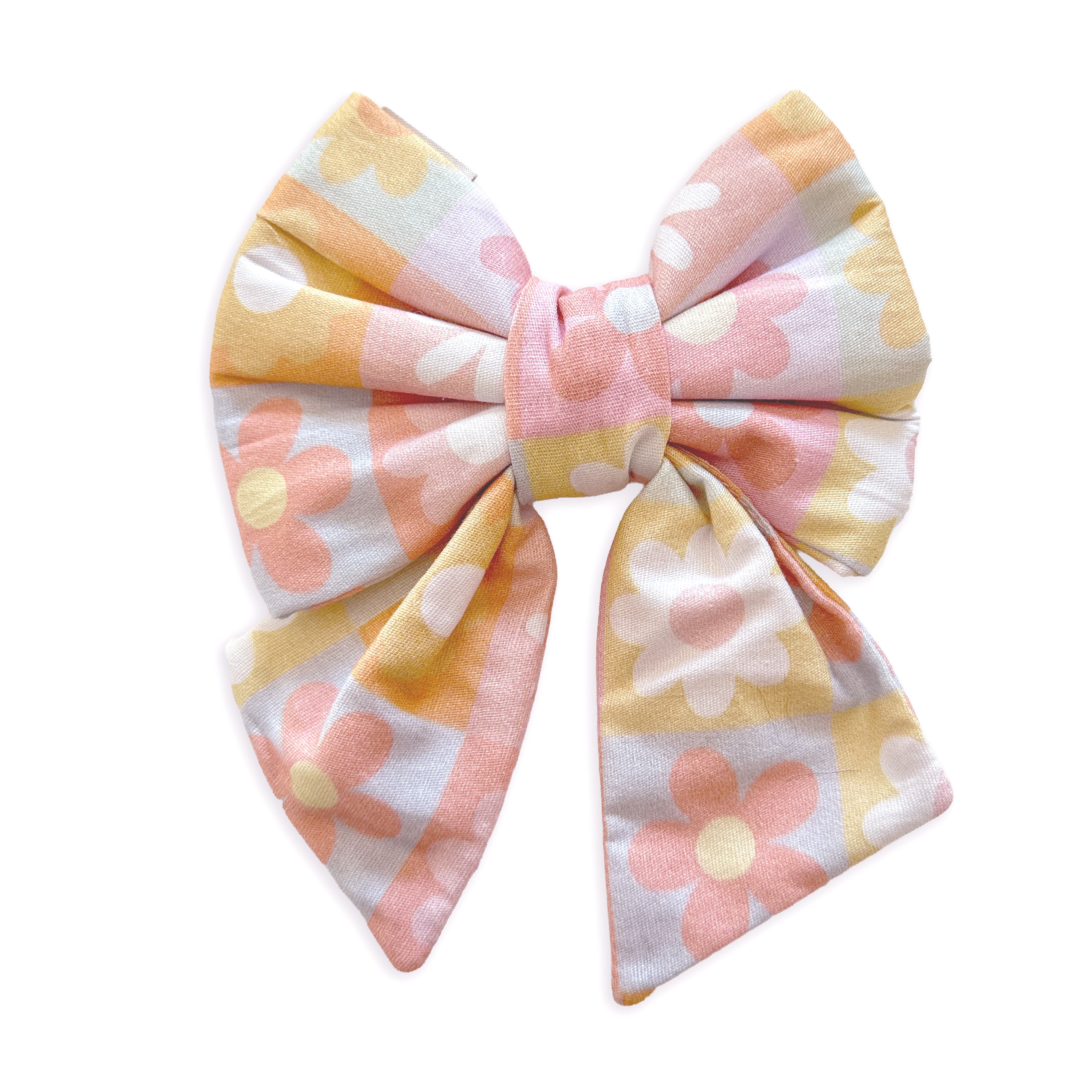 A fabric pet bow with a retro floral pattern in pastel pink, yellow, and white, set against a plain white background.