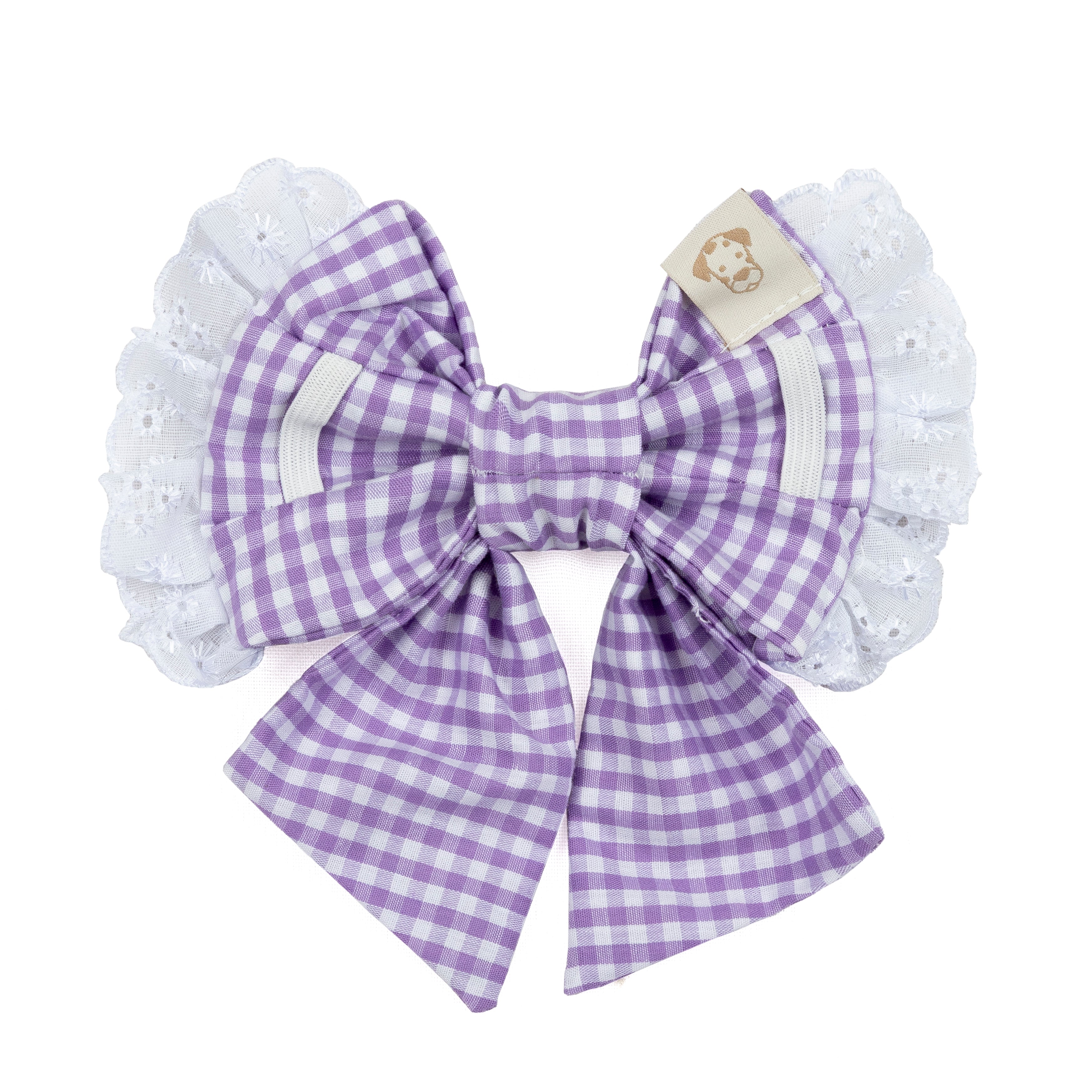 A purple and white gingham bow  white eyelet lace wings and a small beige brand tag, shown on a plain white background.